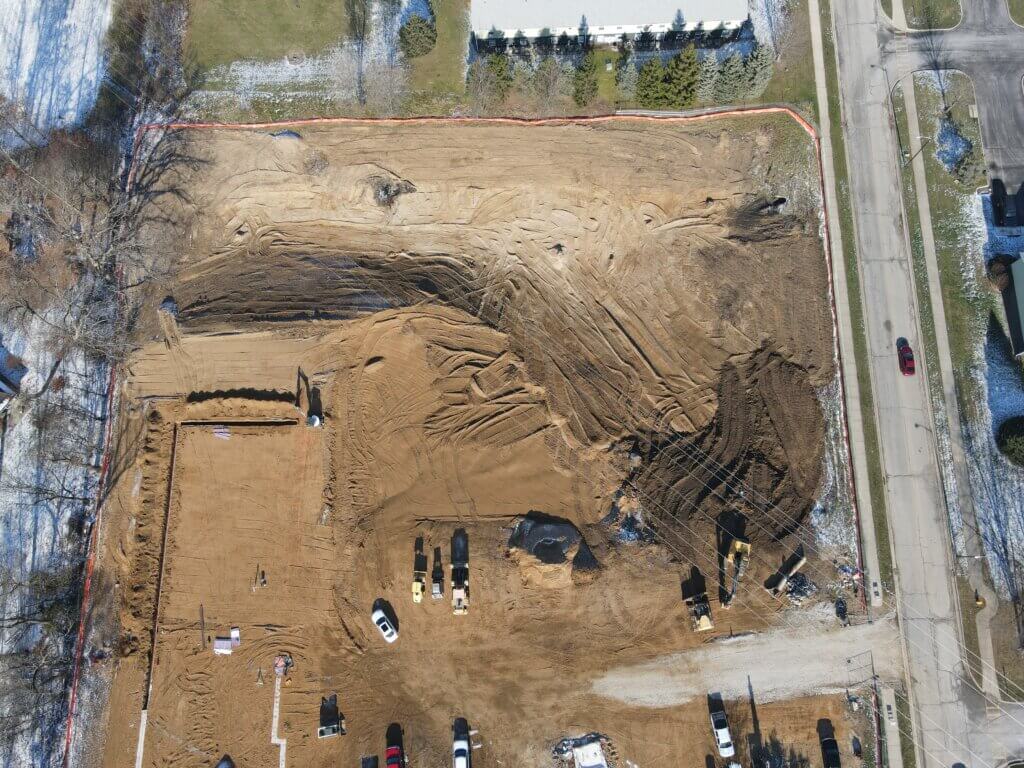 An aerial image of the north side of AHEPA 100-II Senior Apartments construction site during the early stages of construction