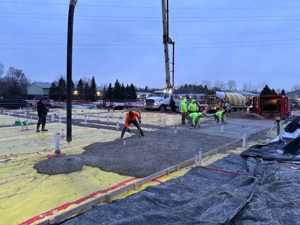 Subcontractors work on making the foundation of the AHEPA 100-II Senior Apartments